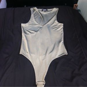 Asymmetric bodysuit with cut out slit in front. Pretty light green runs small.